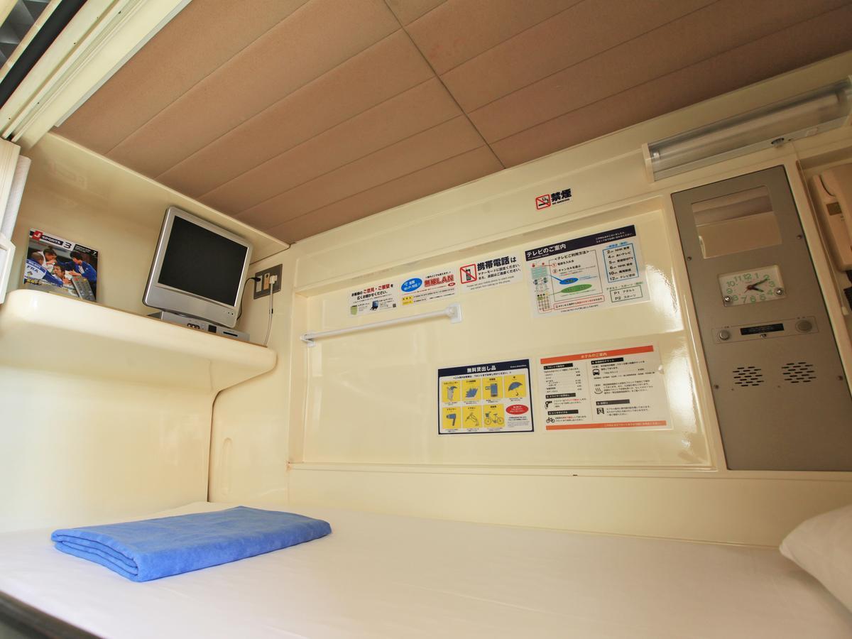 Capsule Hotel New Grand Мацуяма Экстерьер фото